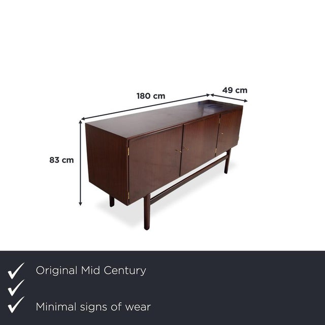 This mid-century sideboard is an exquisite example of top-class Danish design, created by renowned architect Ole Wanscher....