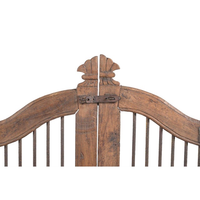 This Vintage Indian Teakwood Garden Gate or "Dog Door" is handcrafted from solid teakwood, featuring gracefully arched top...