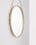 Wall mirror with gilded and decorated brass frame and brass rope, Italian design, 1950s.