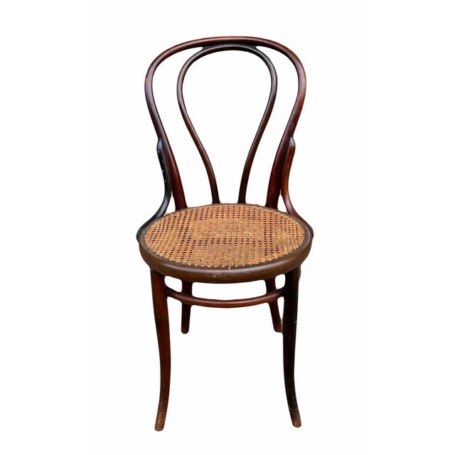 Very early and finely preserved example of Jacob and Josef Kohn's No. 30 Bentwood side chair with original caned seat....