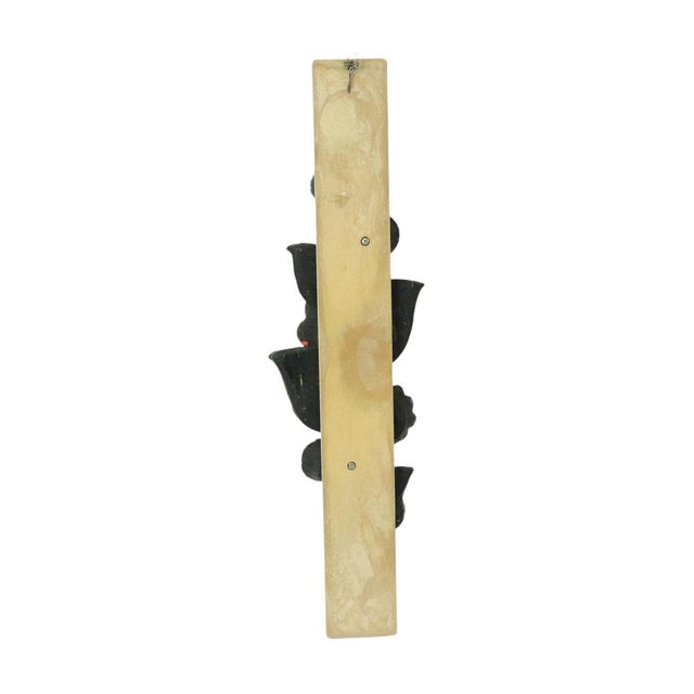 Vintage wall decoration in Brutalist style, sculpture mounted on a white narrow plank, made entirely of resin, by Ars...