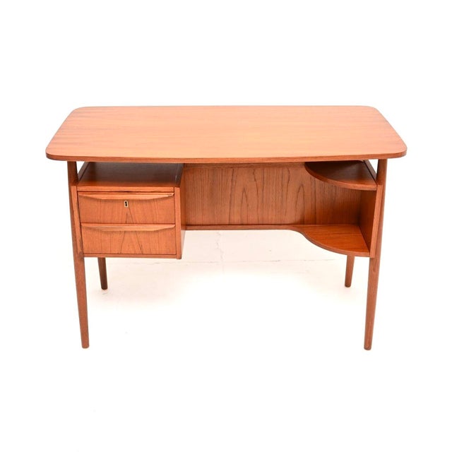 A stylish and very well made Danish Vintage Teak Desk by Gunnar Nielsen for Tibergaard. This was made in Denmark, it dates...