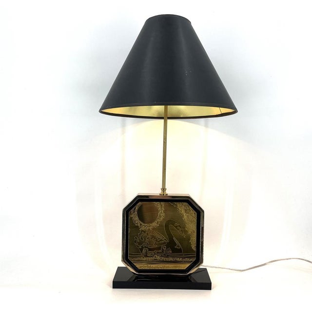 Hollywood regency table lamp designed and manufactured by Georges Mathias in the 1970s. The table consists of a black...