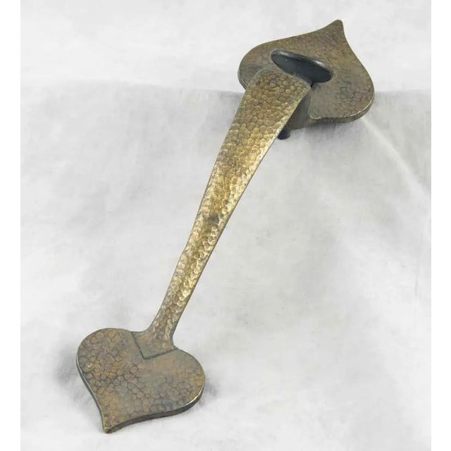 Colonial style hammered door pull with spear shaped plates and a thumb latch. One available. The manufacturer and exact...