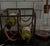 Arthur Umanoff wine rack with blackened iron framework and saddle leather supports, embodying the understated...