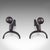 This is a pair of antique andirons. An English, blacksmith made wrought iron fire dog, dating to the late Victorian...
