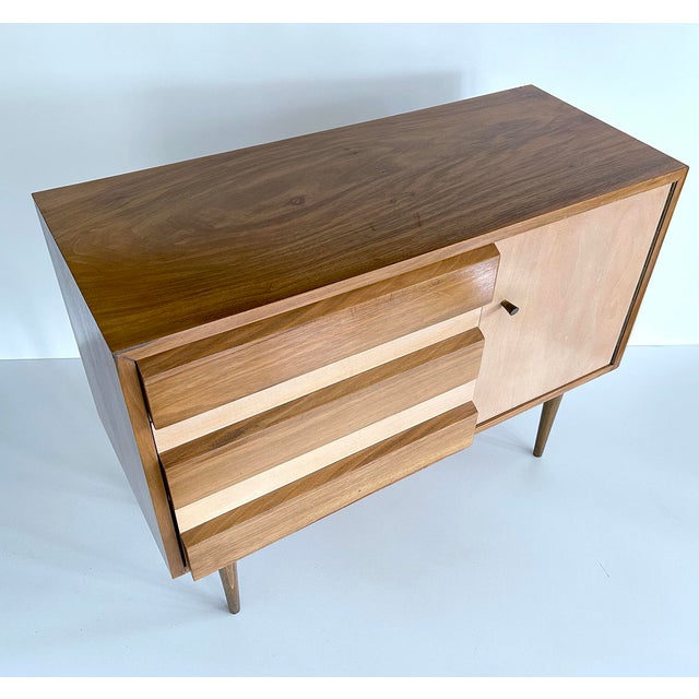 Mid century scandinavian style cabinet / sideboard, two-tone contrasting wood veneer, 3 drawers with slanted facade and a...