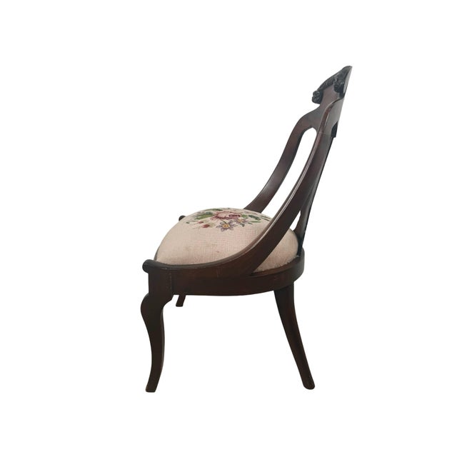 An elegant antique side chair in the Federal and American Classical tradition, featuring a sculptural open back, carved...