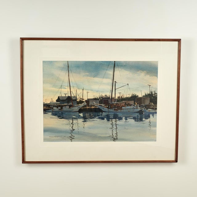 Transporting near pair of marine watercolors both depicting boats in a harbour, executed in realistic style with...