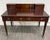 This is a vintage English or Georgian Revival style Bombay Company mahogany writing desk with upper gallery organizer,...
