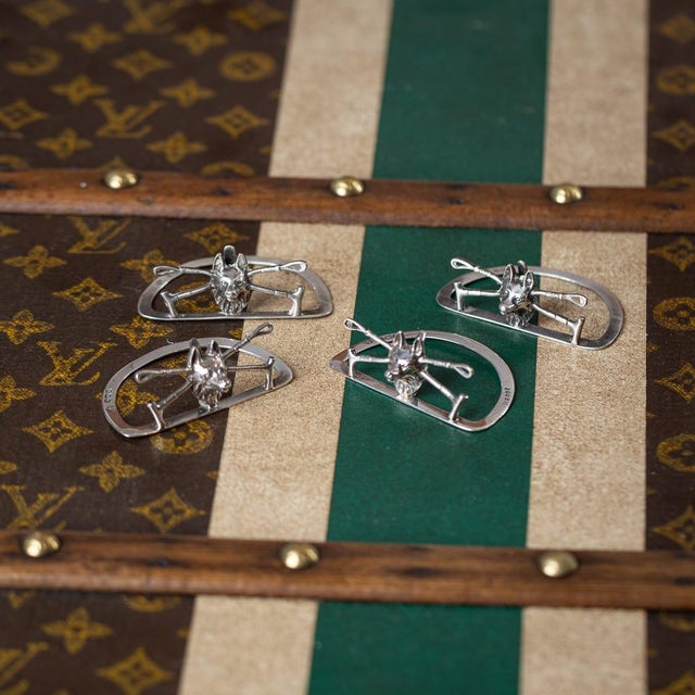 Antique 20th century english solid silver set of four menu holders, each modelled as a fox and whip in a novelty design a...