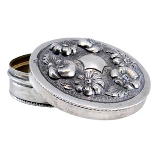 Circular Silver Box with Embossed Flowers on the Lid For Sale