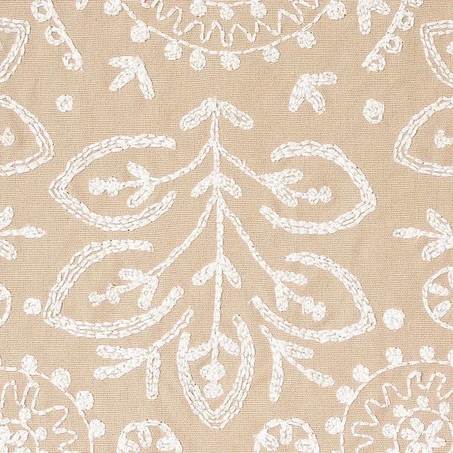 Lacy without feeling too delicate, the mirrored repeat of this unusually large-scale medallion-pattern embroidery has a...