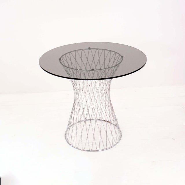 Rare Italian bistro set from the 1970s, consisting of two armchairs and a matching table. An authentic 1970s design...