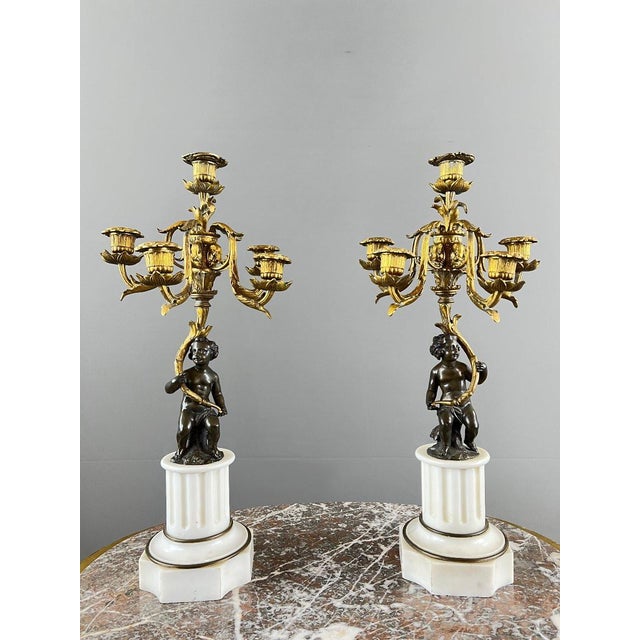 Pair of bronze and marble candelabra, napoleon iii period a superb pair of patinated and gilt bronze candelabra, resting...