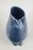European studio ceramicist, unique vase, 1987. Sculptural stoneware vase with a deep blue, subtly variegated glaze and an...