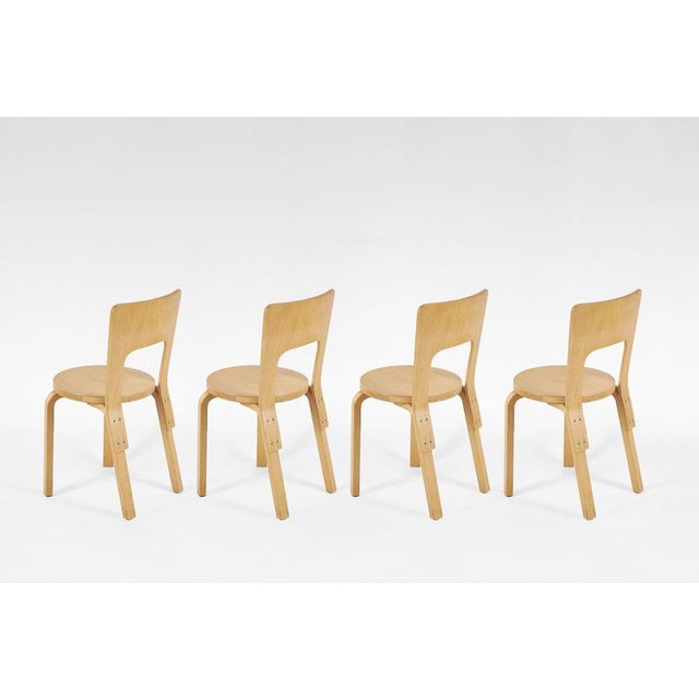 A set of 4 Model 66 dining chairs by Alvar Aalto for Artek, designed in Finland in the 1930s. These Scandinavian modern...