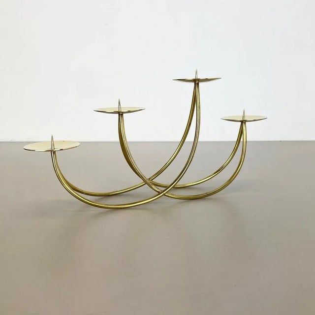 Article: Sculptural candle holder Origin: Germany Producer: Harald Buchrucker Material: Solid brass Decade: 1950s This...