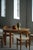 A beautiful and sculptural round oak dining table made in the style of Henning (Henry) Kjærnulf in Denmark during the...