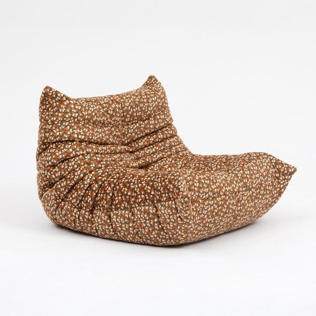 An original vintage Ligne Roset Togo fireside chair with matching ottoman, designed by Michel Ducaroy in 1973 and sourced...