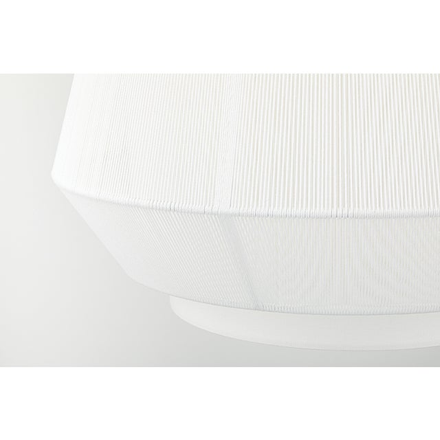 Debi plays with layers, texture, and tone to reveal a multi-dimensional silhouette. A linen drum shade serves as the base,...