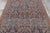This antique 5x8 Persian rug is a richly detailed early 20th-century weaving distinguished by its deep navy field and...