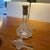 Offered is a gorgeous crystal decanter with silver on the neck. stopper is in perfect condition. There are some slight...