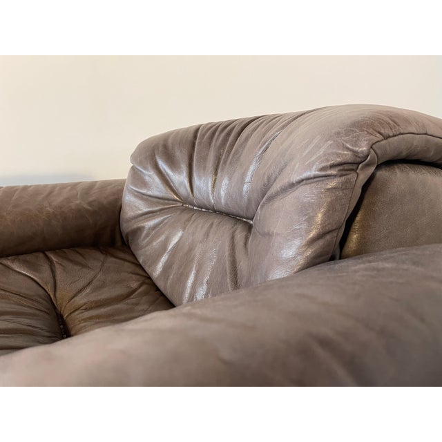 This armchair is finished in a beautiful grey. The leather is in lovely condition, though slightly faded from the sun in...