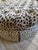 Fabulous large round tufted ottoman with heavy leopard upholstery fabric....very Scalamande quality but I don't know which...