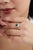 This vintage-style cocktail ring features a 1.88 ct square-cut emerald, set in 14K yellow gold. The center stone measures...
