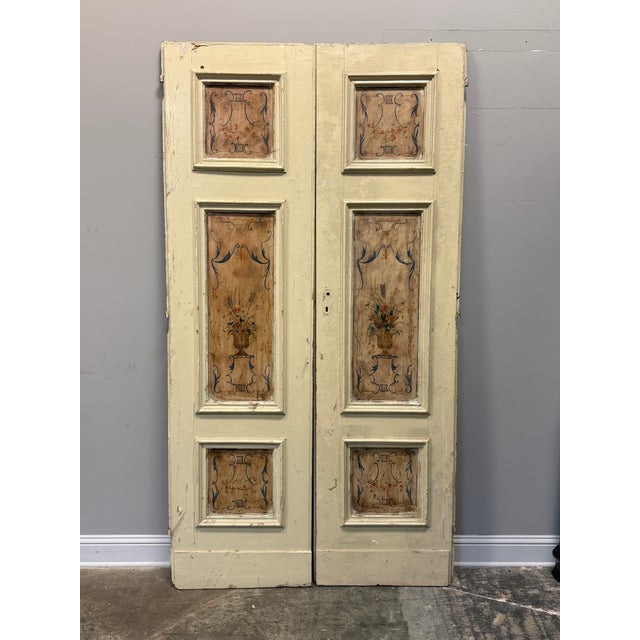 Two pair Italian hand painted double wing doors featuring lacquered wood panels decorated with floral and baroque shapes...