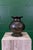 Cavorting lion motif on body and stylized floral motif etching on rim. A stunning bronze vase, hand forged and decorated...