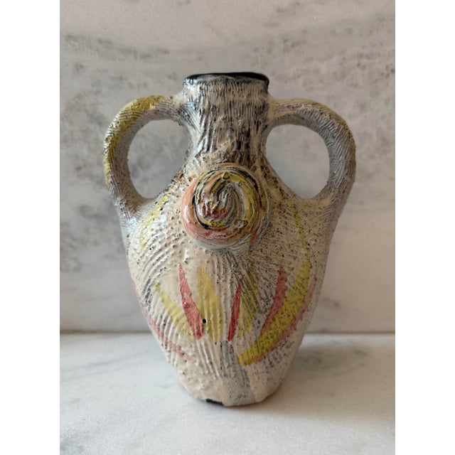 Vintage studio art pottery vase with handles and and painted slips and thick textured glaze. Each side has a distinct...