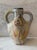 Vintage studio art pottery vase with handles and and painted slips and thick textured glaze. Each side has a distinct...