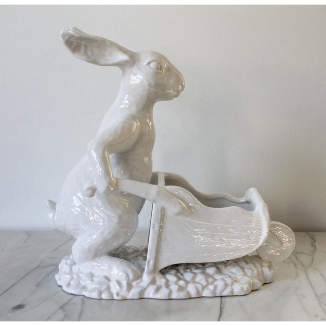 Vintage white porcelain bunny rabbit figurine pushing a wheelbarrow. No makers mark. Very minor age wear. Small marks on...