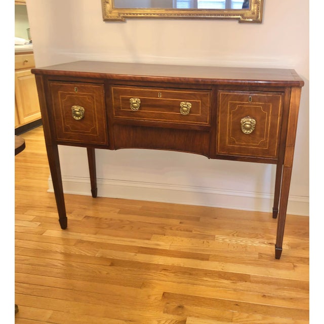 Gorgeous European mahogany sideboard with inlay in Hepplewhite style. Excellent condition.