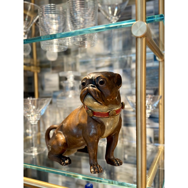 A 19th-century terra cotta pug figurine with cold-painted details, perfect for dog lovers and antique collectors. Crafted...