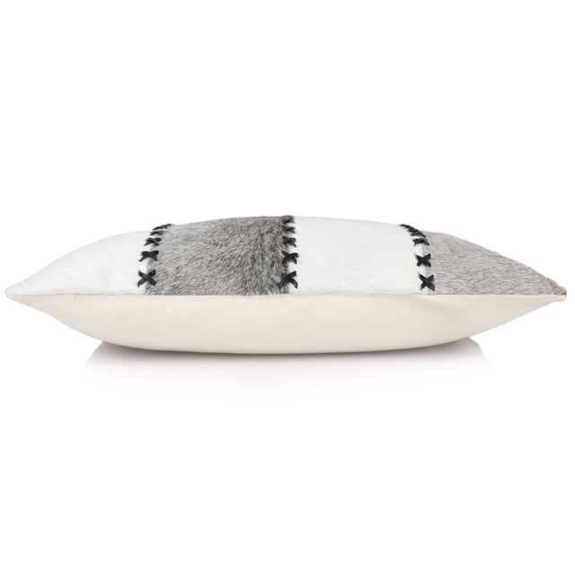 Timeless craftsmanship meets modern luxury in this 16 x 24 inch genuine cowhide leather lumbar pillow, thoughtfully...
