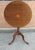 George III Style Satinwood Inlaid Mahogany Tilt Top Candle Stand / Side Table Measures 17" in width, 17" in depth and...