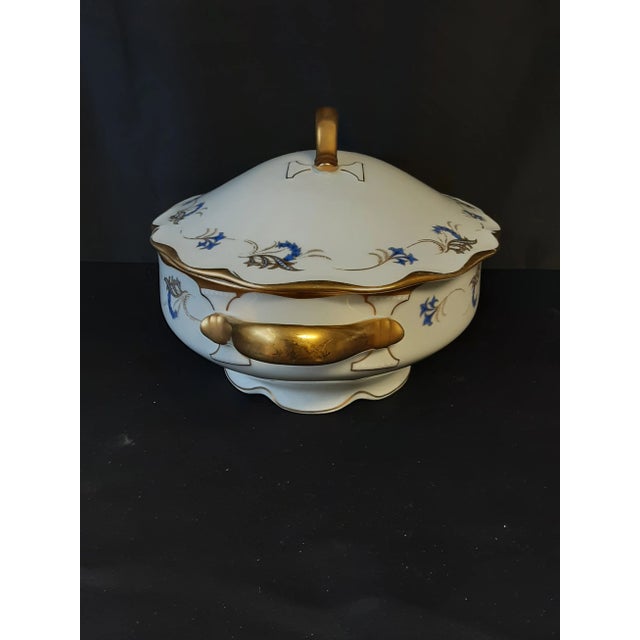 Beautiful large porcelain KPM Tureen,with spoon. Gold paint trim on the edges, with blue and gold hand painted design.