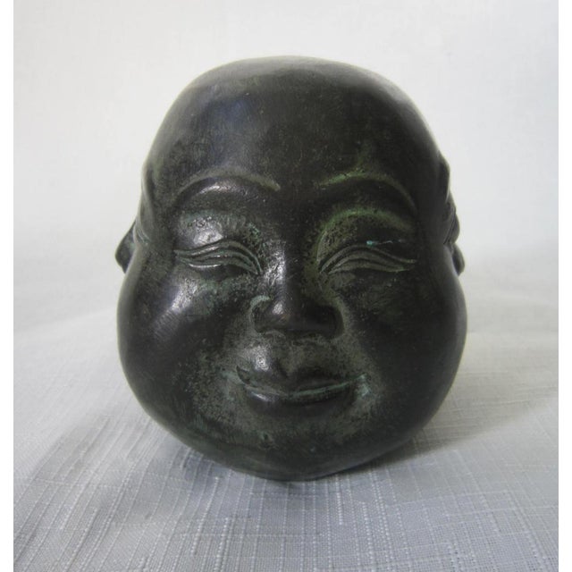 Bronze statue representing Buddha with four faces, a rare piece imbued with spirituality, ideal for lovers of Asian art...