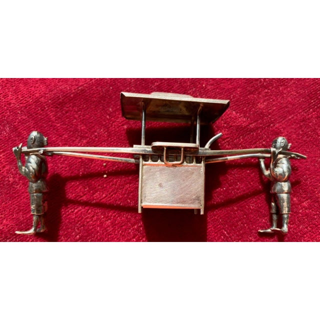 Silver miniature sedan chair with carriers hand crafted in China. Sedan chairs and palanquins were seen in China hundreds...