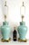 Offering a pair of soft turquoise ceramic and brass Chinoiserie style table lamps, circa 1980s.. These lovely RESTORED...