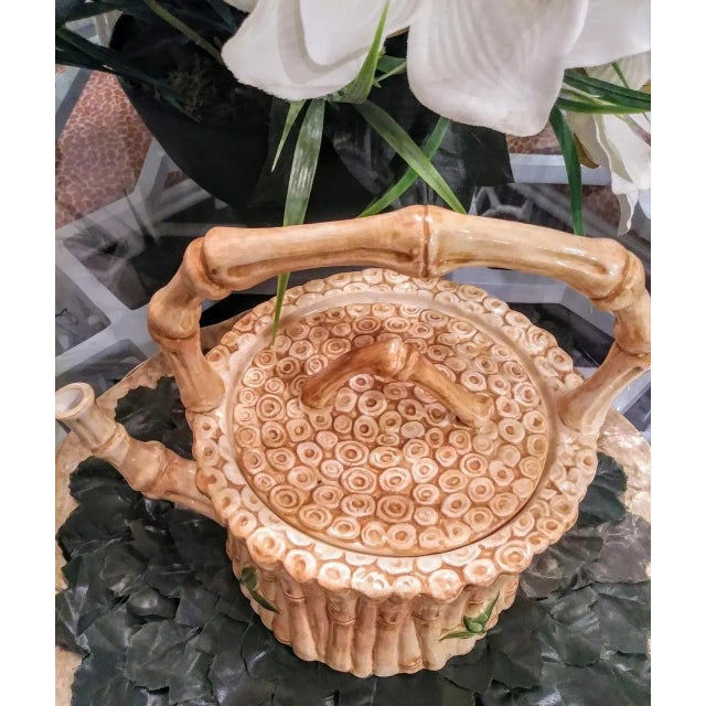 A gorgeous Italian ceramic teapot by Vietri. This teapot has beautiful details to it with faux bamboo all around and a...
