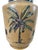The Raymond Waite Tan Ginger Jar with Palms and Crest is a vintage collectible piece with intricate details showcasing...