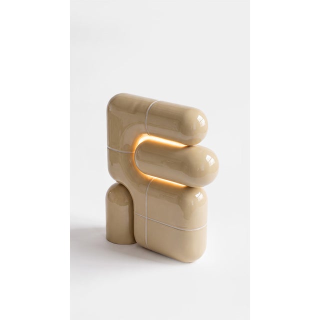 The smallest lamp in the collection, and often the first one people reach for. Its folded form hides the source entirely,...
