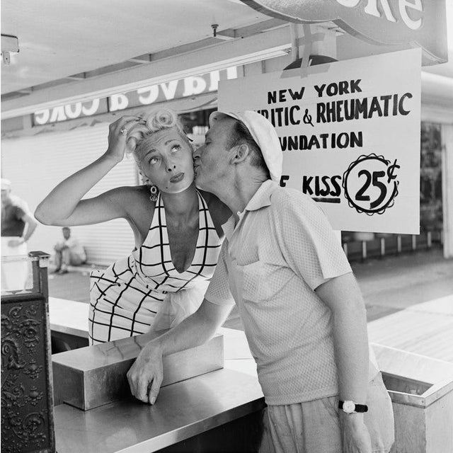 Kissing Booth A kissing booth in aid of the New York Arthritic and Rheumatic Foundation, charging 25 cents a kiss, USA,...
