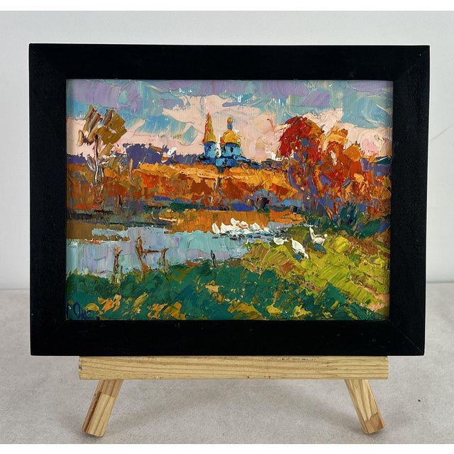 Oil painting Evening at the Church Pond Oksana Ivanyuk is a vibrant landscape that captures the warm atmosphere of an...