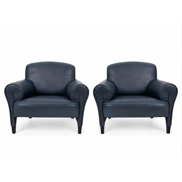 The DS 90 armchair by de Sede is upholstered in blue genuine leather and stands on simple legs. It is characterized by its...