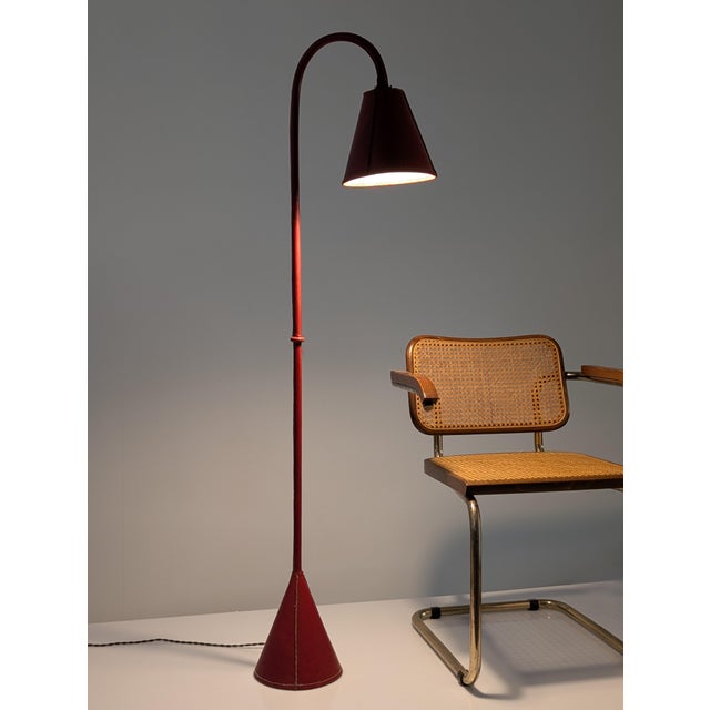 Mid-Century Modern Floor Lamp in Red Leather attributed to Jacques Adnet, France, 1960s, in Good conditions. Designed 1960...